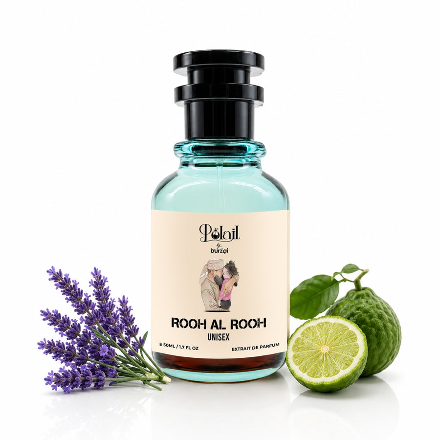 A bottle of Polail by burzai Rooh Al Rooh unisex perfume, styled with a sprig of purple lavender, a lime half, and a whole lime on a white background.