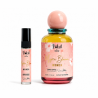 'Polail by burzai Mystic Bloom' women perfume set, featuring a 10 mL rollerball bottle and a 50 mL glass spray bottle with a pink label, a pink spherical cap, and a teal glass neck, on a white background.